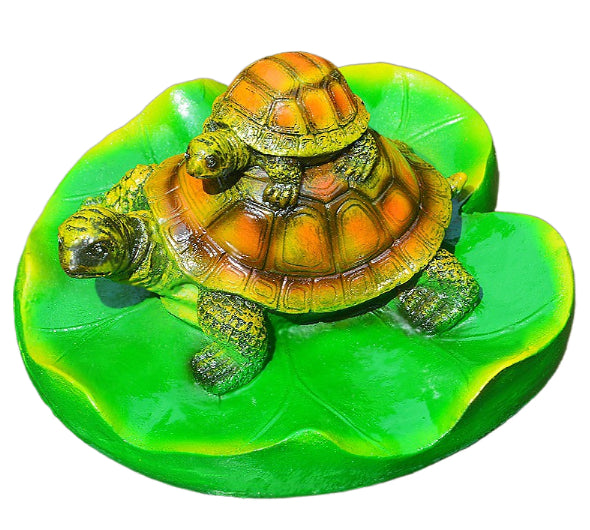 Turtle resin ornaments floating on the water surface