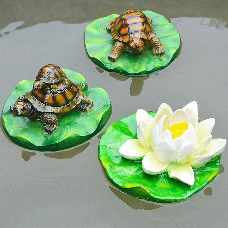 Turtle resin ornaments floating on the water surface
