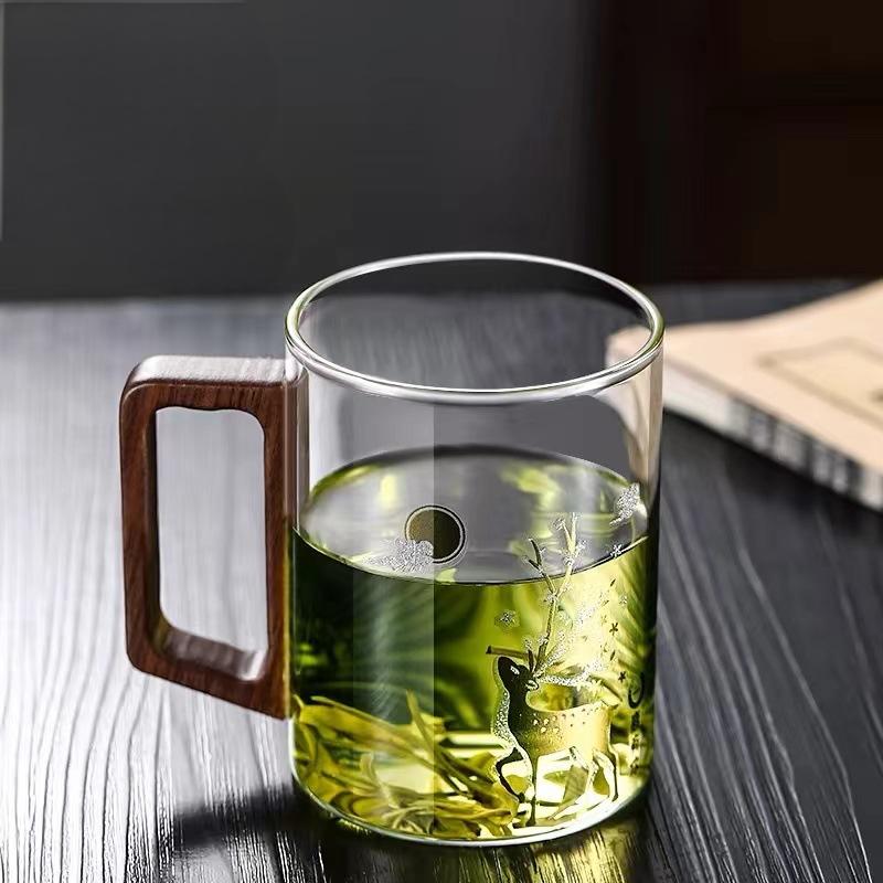 High end green tea cup with walnut handle and lid. High temperature resistant glass office drinking cup