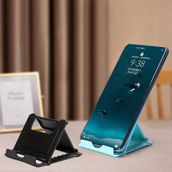 A plastic, foldable cradle for mobile phones