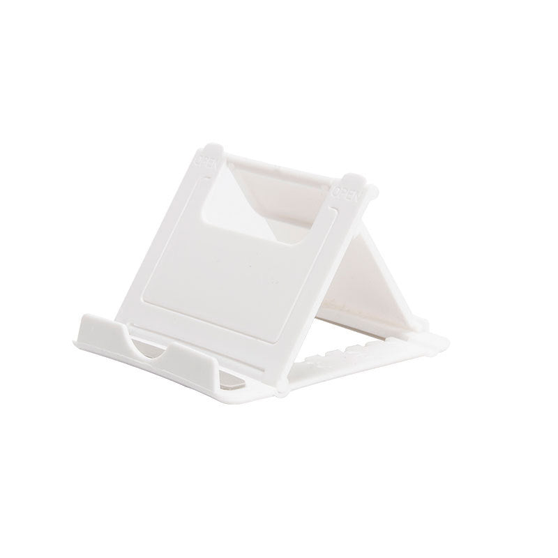 A plastic, foldable cradle for mobile phones