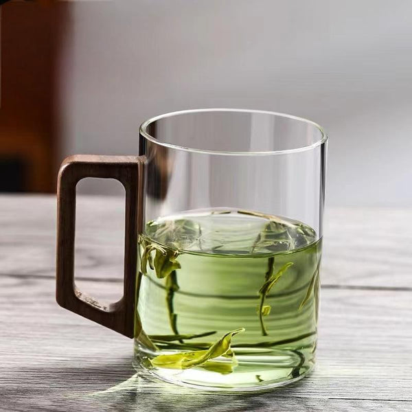 High end green tea cup with walnut handle and lid. High temperature resistant glass office drinking cup