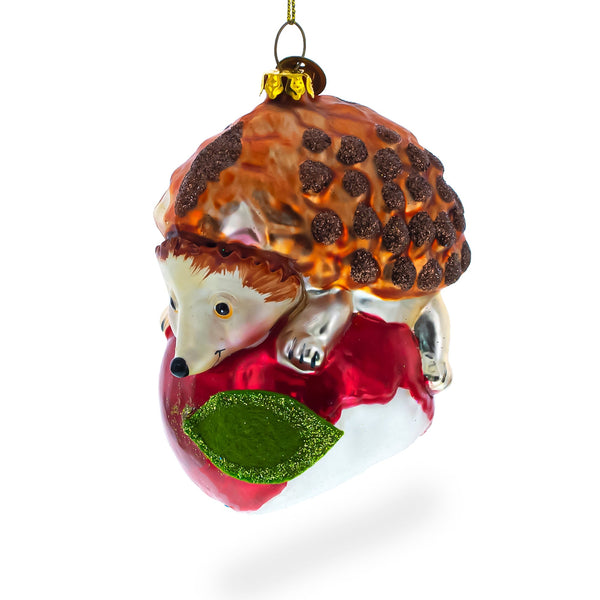 Hedgehog Savoring a Red Apple Glass Christmas Ornament